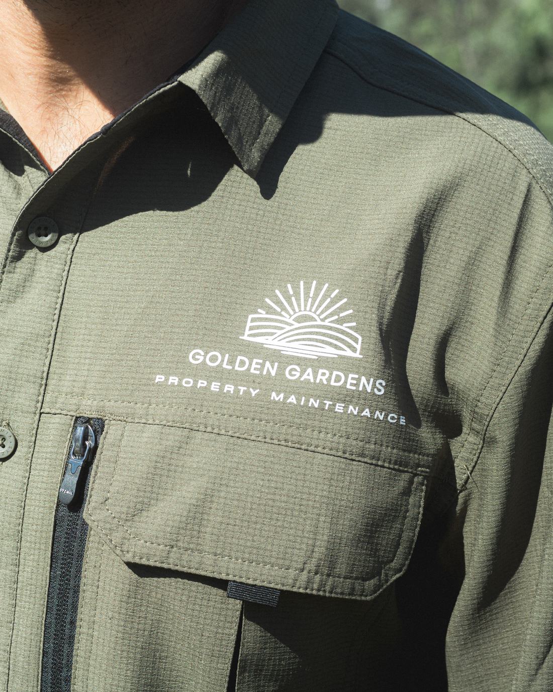 Close-up of the Golden Gardens uniform logo